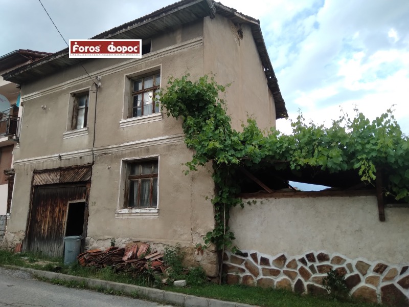 Продава КЪЩА в област Благоевград, с. Бачево - 140 кв.м / 26 000 € » 50 851.58 лв., ФОРОС-НАЦИОНАЛНА КОМПАНИЯ НЕДВИЖИМИ ИМОТИ-БАНСКО